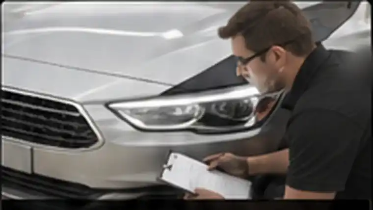 Front body-panel alignment being checked after repairs